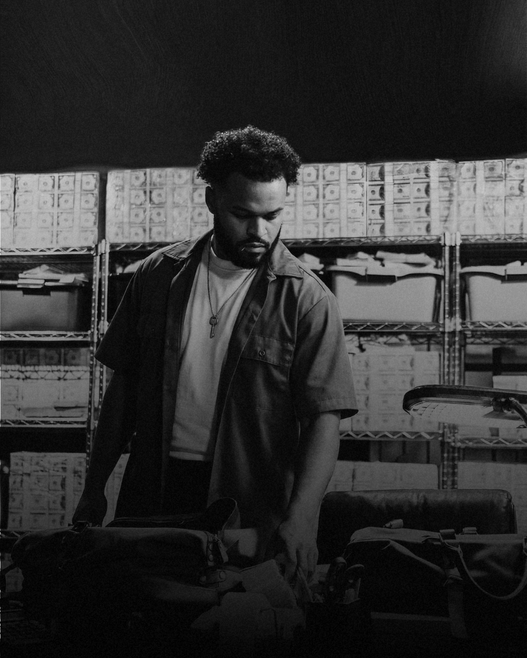 Jared T. Ross standing in front of an archive wall
